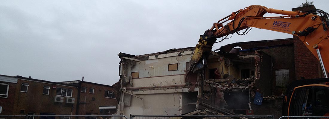 Doosan DX255 excavator during demolition of building