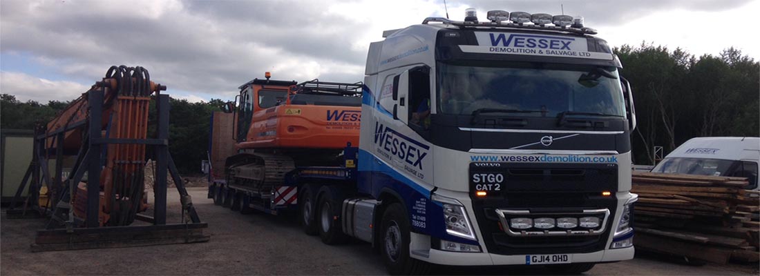 Volvo FH540 Low Loader moving an excavator from the yard in Southampton, Hampshire