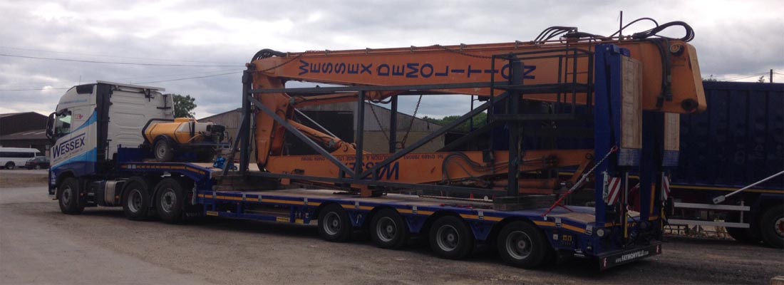Excavator demolishing building in Chippenham, Wiltshire